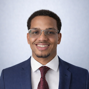 Professional headshot of Alexander Estrella